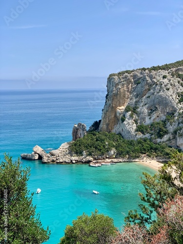 Sardinia beach blue and turquoise with cliff