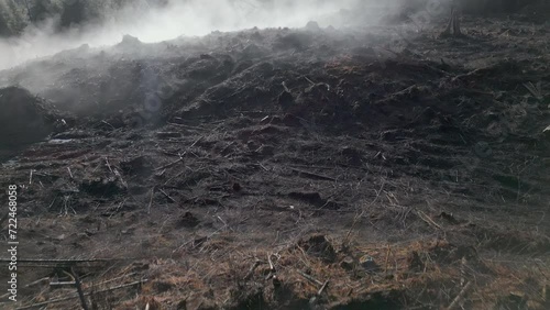 Foggy morning flyover of deforested field
