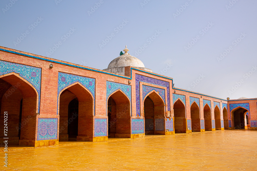 Fototapeta premium Shah Jahan Mosque in Thatta, Pakistan. Beautiful architecture, yellow, blue and orange colors. 