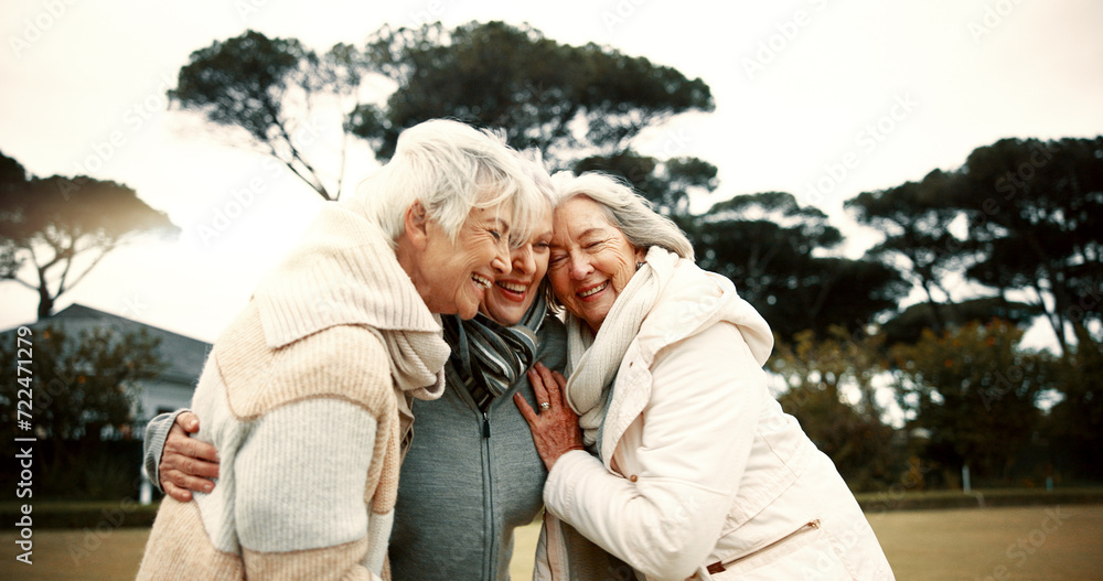 Fototapeta premium Talking, laughing and elderly woman friends outdoor in a park together for bonding during retirement. Happy, smile and funny with a group of senior people hugging in a garden for humor or fun