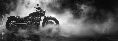 A black motorcycle surrounded by smoke - banner with copyspace photo