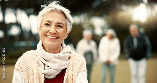 Face, senior woman and smile in nature on vacation, holiday or travel in winter. Portrait, happy and elderly person in the countryside, park or garden for wellness, freedom or fresh air in retirement photo