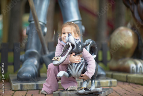 In the Shadow of Giants, An Enchanting Encounter Between a Little Girl and Her Plush Companion