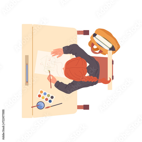 Little school girl cartoon character drawing with paints sitting at desk during art lesson top view