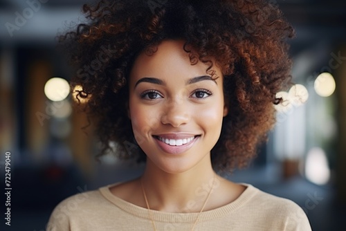 A woman with curly hair smiling at the camera. Perfect for lifestyle and beauty-related projects