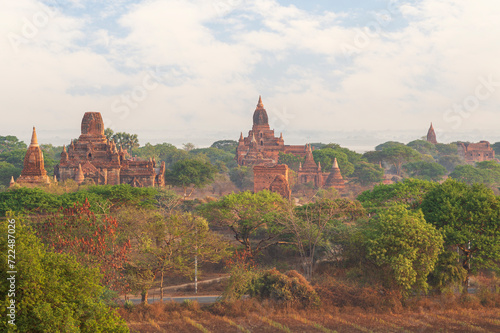 Scenic landscape of several ancient temples  pagodas and ruins at the plain of Bagan in Myanmar  Burma  on a sunny morning.