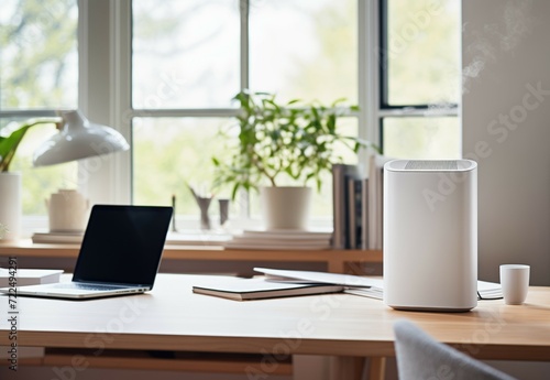 Air purifier or aromatherapy diffuser humidifier in a home office setup with simple and modern design. photo