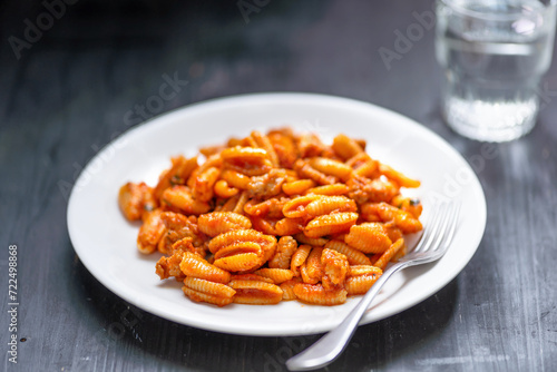 Obraz na płótnie gnocchetti pasta in sausage tomato sauce w salonie