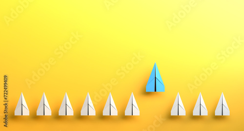 Leadership concept, blue leader plane, standing out from the crowd of white planes, on yellow background with empty copy space. 3D Rendering