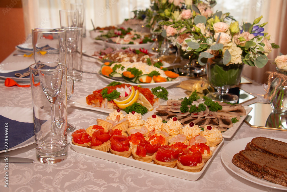 The banquet is festive, beautiful table setting, a table with very tasty meat and fish dishes. The banquet is festive, beautiful table setting, a table with very tasty meat and fish dishes.