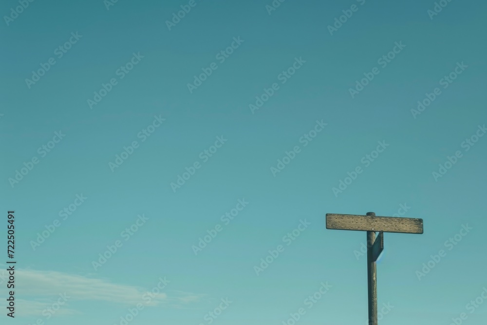 A rustic signpost stands tall against the clear blue sky, beckoning travelers to explore the vibrant street below and follow their wildest dreams A rustic signpost stands tall against the clear blue sky, beckoning travelers to explore the vibrant street below and follow their wildest dreams