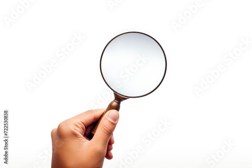 Hand holding a Magnifying glass symbol of search. discovery and finding concept. Magnifying glass in hand isolated on white background. Close up.