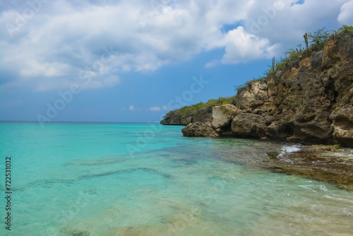 Little Knip beach - paradise white sand beach with blue sky and clear azure water in Curacao  Netherlands Antilles  a Caribbean tropical Island.