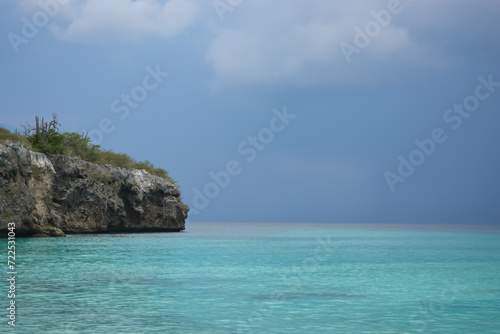 Little Knip beach - paradise white sand beach with blue sky and clear azure water in Curacao, Netherlands Antilles, a Caribbean tropical Island.