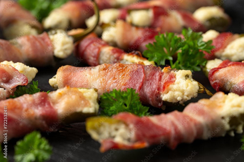Homemade Bacon Wrapped Jalapeno Poppers with Cream Cheese and herbs. Homemade Bacon Wrapped Jalapeno Poppers with Cream Cheese and herbs.