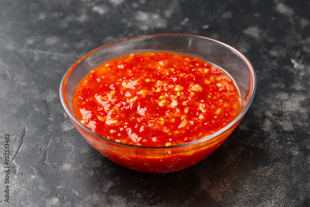 Hot Sweet chilli sauce in glass bowl Hot Sweet chilli sauce in glass bowl