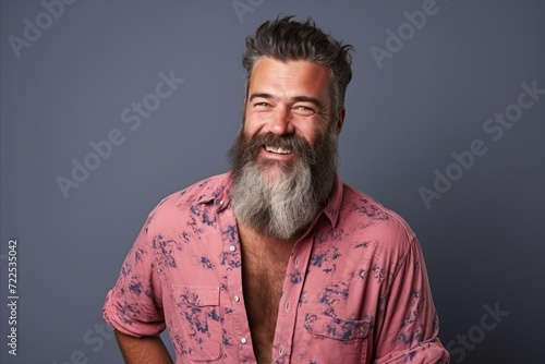 Portrait of a happy mature man with long gray beard and mustache.