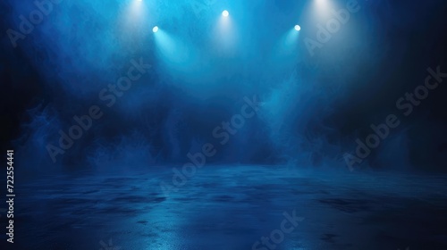 The dark stage shows, dark blue background, an empty dark scene, neon light, spotlights The asphalt floor and studio room with smoke float up the interior texture for display © buraratn