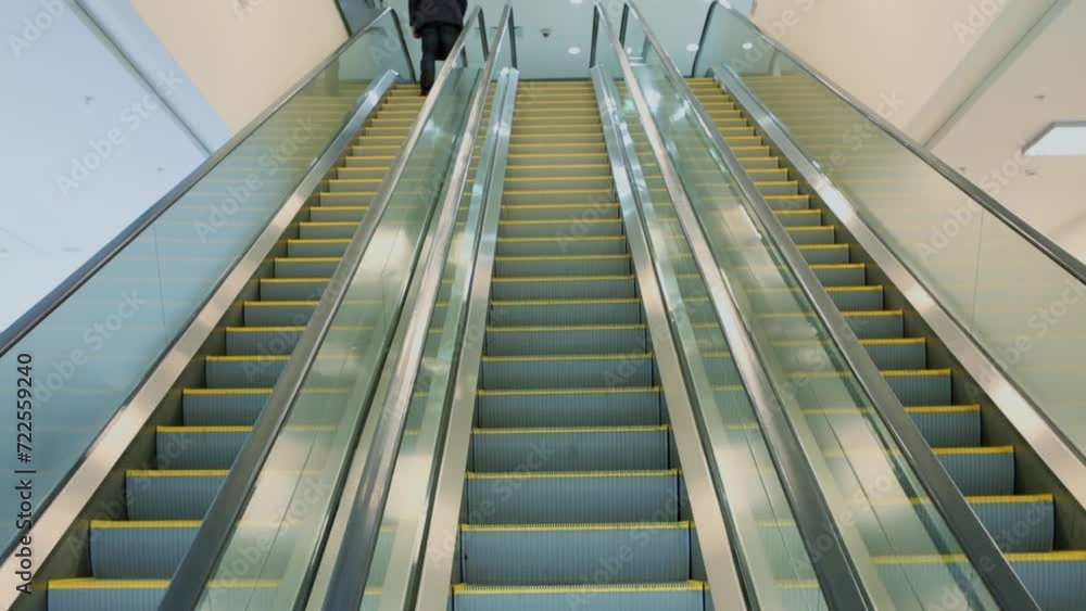 Three lathes of escalator moves up and down inside hotel Three lathes of escalator moves up and down inside hotel