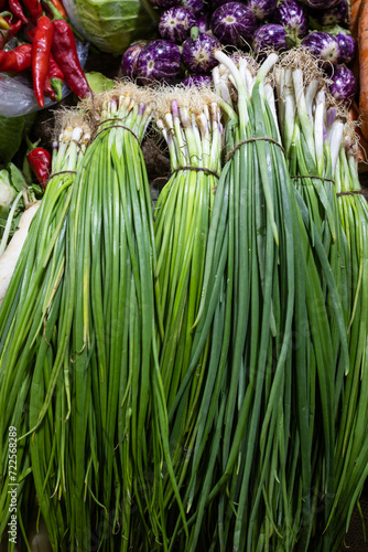 spring onions at vegetable store for sale at evening