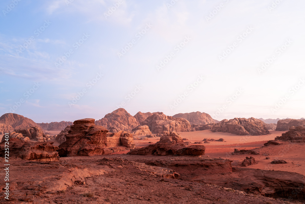 Landscape - Wadi Rum, Jordan. A beautiful vibrant sunset, Arabian desert, a dystopian martian landscape with unique rock formations and dunes. Backdrop for graphic resource or copy space
