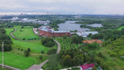 Cityscape with golf-club in Krylatskoe on river shore at cloudy day