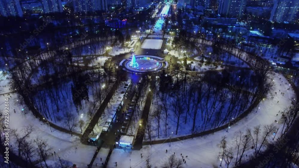 Public garden Sokolniki with crowd of people get fun on skating rink Public garden Sokolniki with crowd of people get fun on skating rink