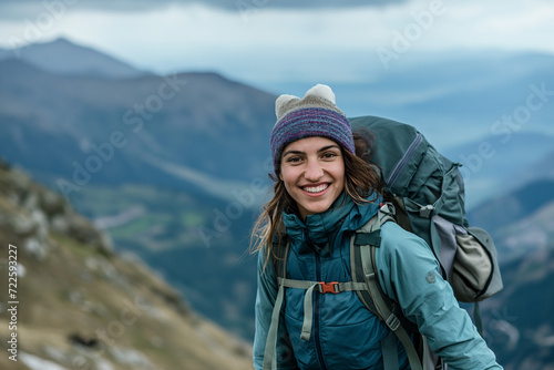 Woman Hiking With Backpack on Mountaintop © Ilugram