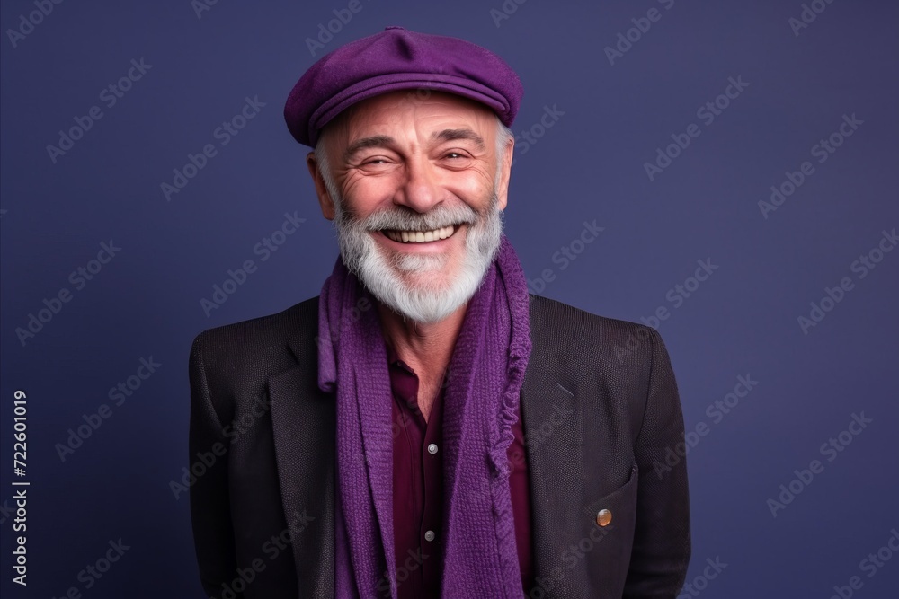 Portrait of a happy senior man with gray beard and mustache wearing a purple beret on a blue background. Portrait of a happy senior man with gray beard and mustache wearing a purple beret on a blue background.