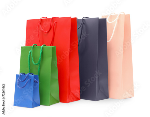 Many colorful paper shopping bags isolated on white