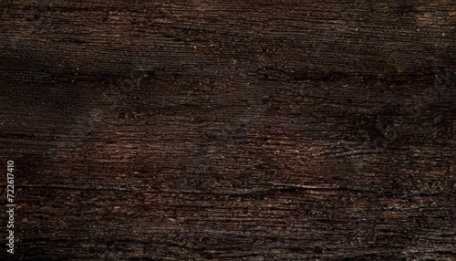 Dark brown grungy natural wood texture background
