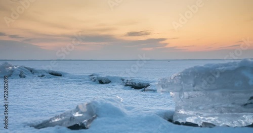 Sunset over a frozen lake in winter