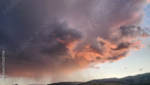 Evening Redish Cloudy Sky Over the Mountain