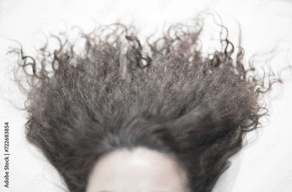 People and women's body parts show long, curly, and poorly maintained hairstyles. People and women's body parts show long, curly, and poorly maintained hairstyles.