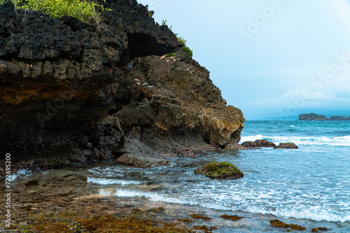 A hidden beach that is still very empty of tourists in Pacitan district, East Java province, Indonesia, which has white sand and charming waves. The beach with a very beautiful view in the morning