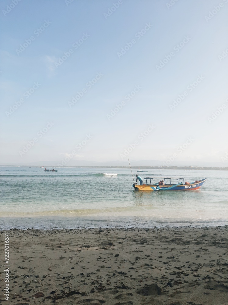 Beautiful view of waving blue sea and sky in tropical summer, Pangandaran beach, Java, Indonesia. Travel or vacation