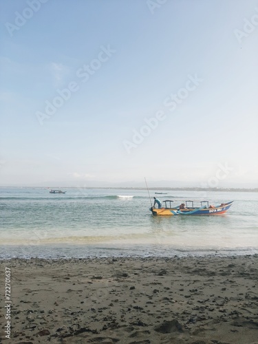 Beautiful view of waving blue sea and sky in tropical summer, Pangandaran beach, Java, Indonesia. Travel or vacation
