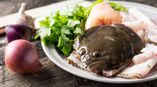 Trimmed flatfish and crown daisy photo