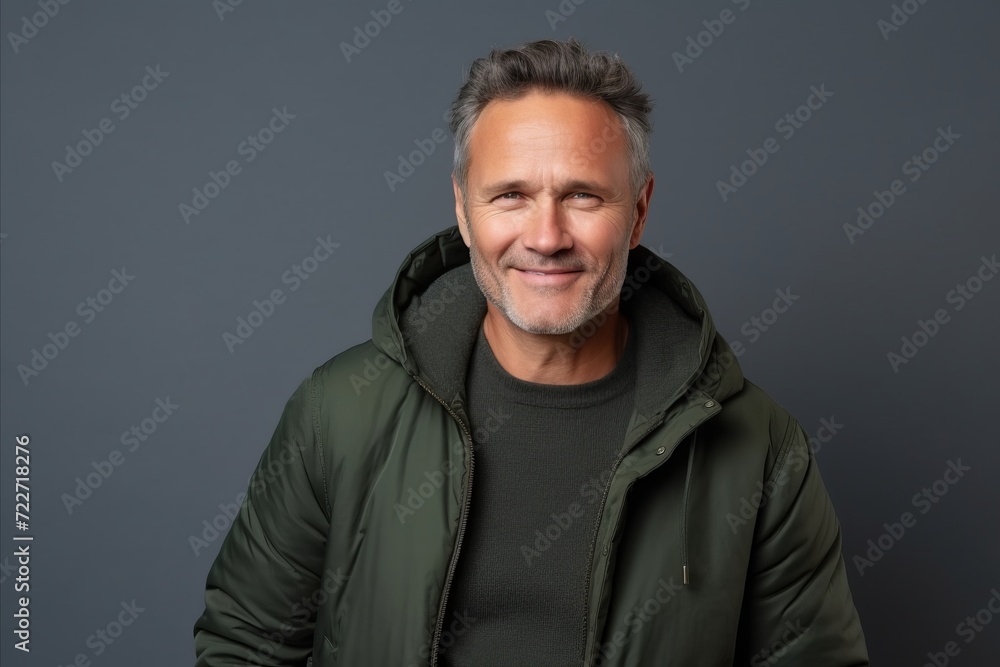 Portrait of a handsome middle-aged man in a green jacket Portrait of a handsome middle-aged man in a green jacket