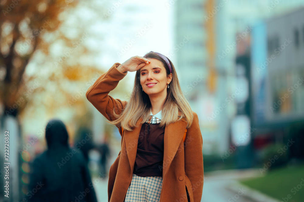 Fashionable Woman Wearing Autumn Coat Rocking Preppy Look. Trendy fashionista displaying cool street style outfit 
