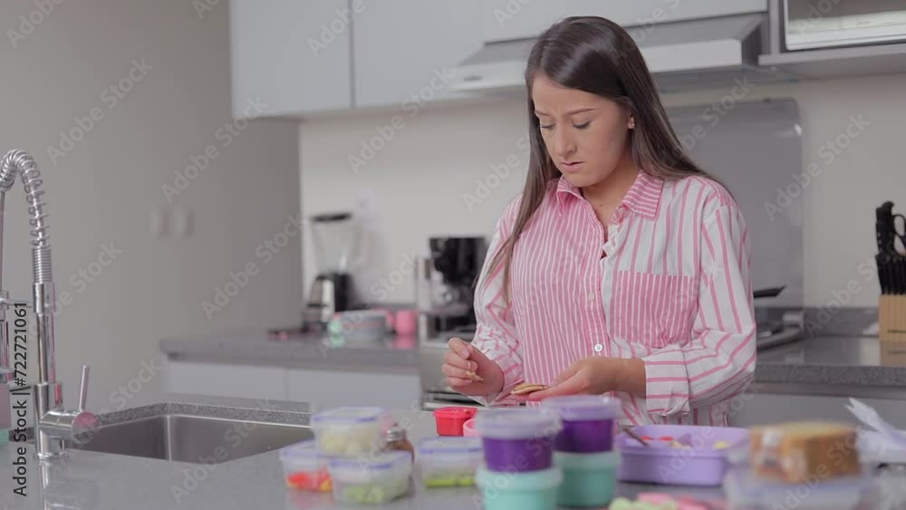 Mother preparing food for her daughter in the kitchen at home Mother preparing food for her daughter in the kitchen at home