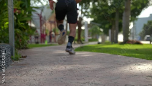 Wallpaper Mural Slow motion of a shirtless man running sprinting away from the camera getting progressively out of focus Torontodigital.ca