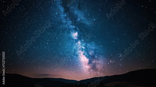  the night sky is filled with stars and the milky shines brightly above the mountains and trees in the foreground.