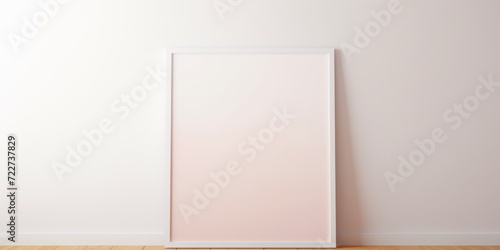 A blank mockup with a white frame is placed on a wooden floor against a white wall, providing a clean and minimalist setting for customization.