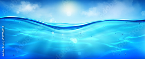 Photos Sea or ocean water surface level with underwater with bubbles, sun rays and sky with clouds background textures