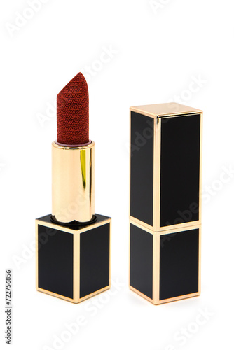 Lipstick in a luxury case isolated on a white background.	