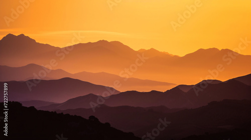 Orange sky over silhouette mountains in Montes