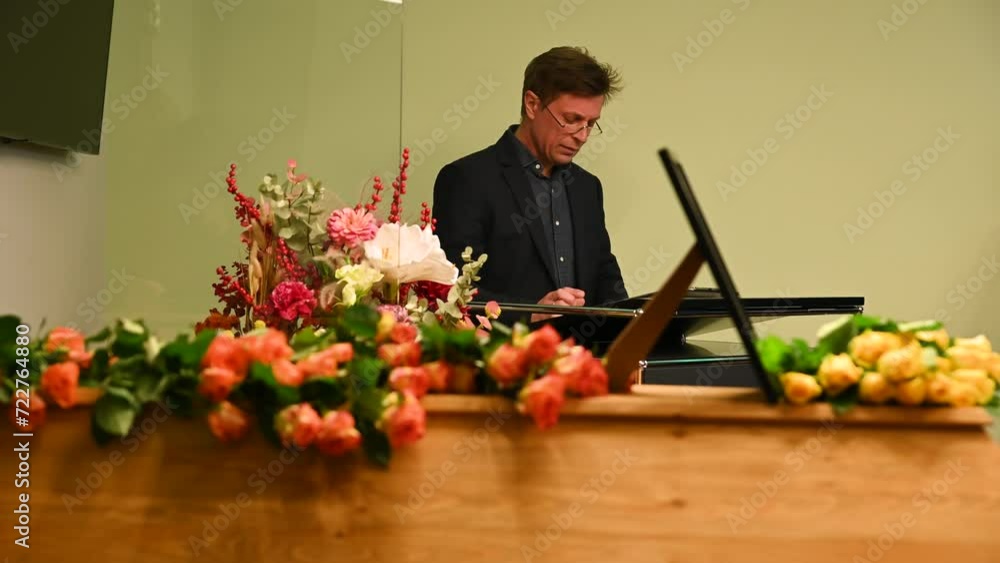 the priest conducts the funeral service. hard times. funeral service