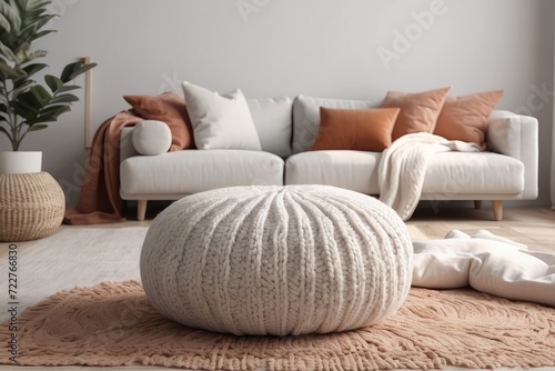 white fabric sofa with blanket and terra cotta pillows Scandinavian hygge style home interior design of modern