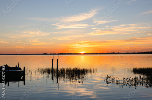Golden hour horizon overlooking lake with beautiful sky